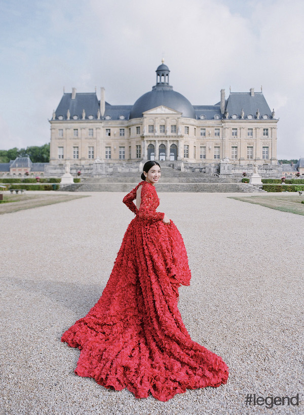 Carmen Yim wears red gown by Kev Yiu 