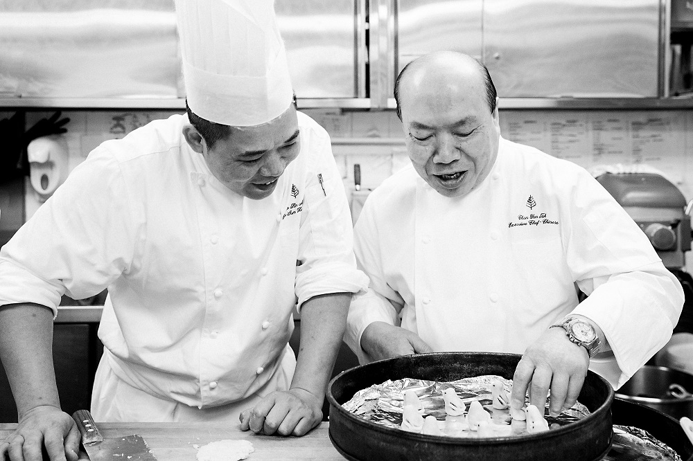 Chef Ming prepares a dessert with chef Chan Yan-tak of Lung King Heen