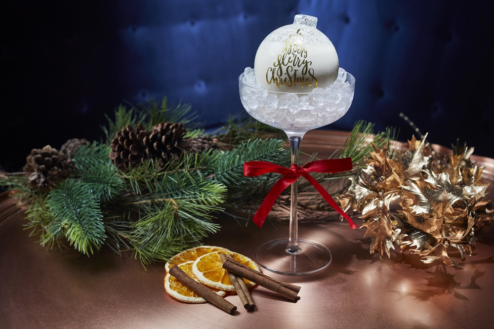The Noel Nightcap is served inside an adorable glass ornament
